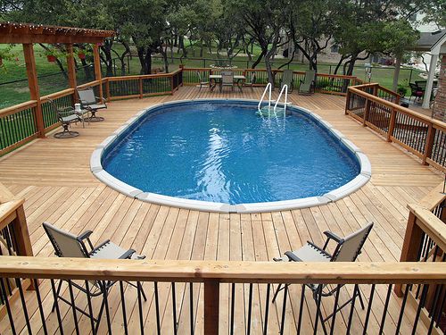 pictures of above ground pools with decks | above ground oval pool .