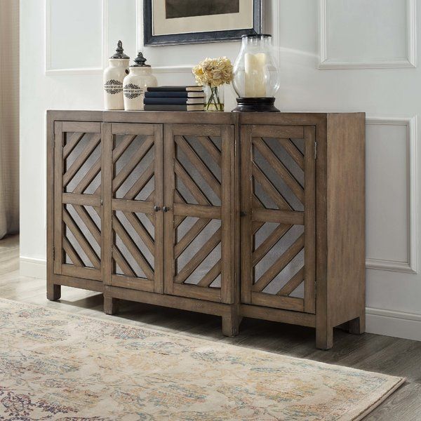 The mirrored insets on this rustic credenza will reflect your good .