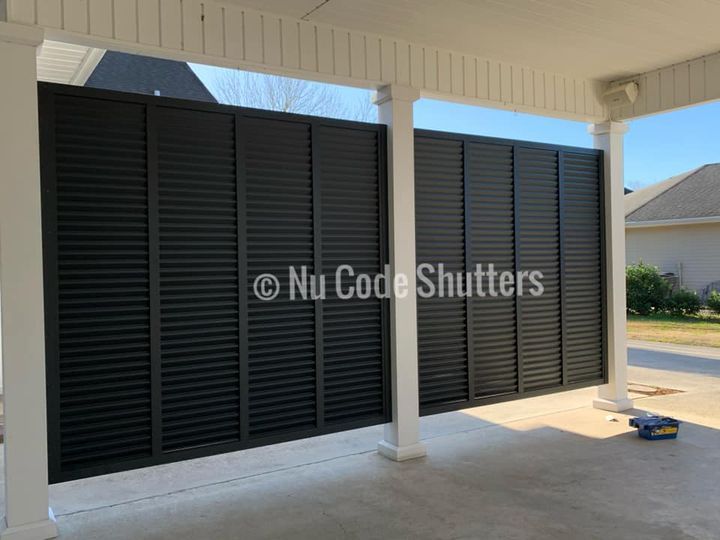 Aluminum powder coated shutter wall on carport (inside view .