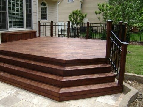 Beautiful pressure-treated wood deck with aluminum rail and .