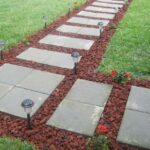 Front Walkway built out of inexpensive cement pavers, red lava .