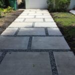 Concrete paver staggered squares design. With 1" gray granite .