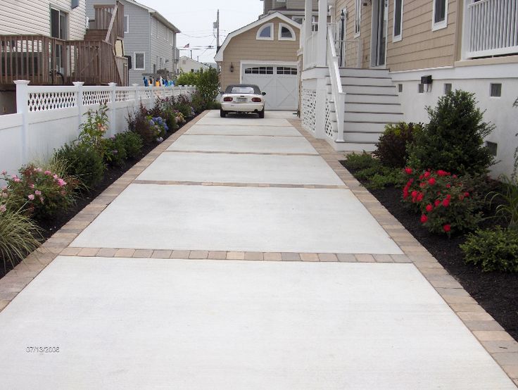 Like Concrete and Paver driveway or concrete with stamped edge .