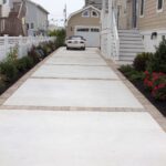 Like Concrete and Paver driveway or concrete with stamped edge .