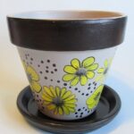 Hand-painted flower pot! Grey, Yellow and black floral design .