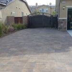 Interlocking pavers that form a driveway extension for RV access .