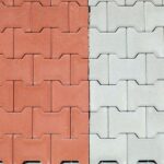 Red and gray interlocking concrete paver blocks. Tiles for outdoor .
