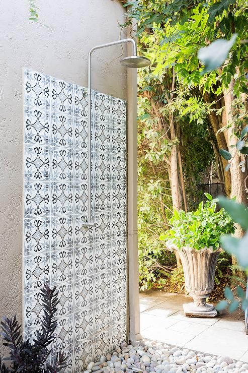 Stunning outdoor shower boasts a vintage exposed plumbing shower .
