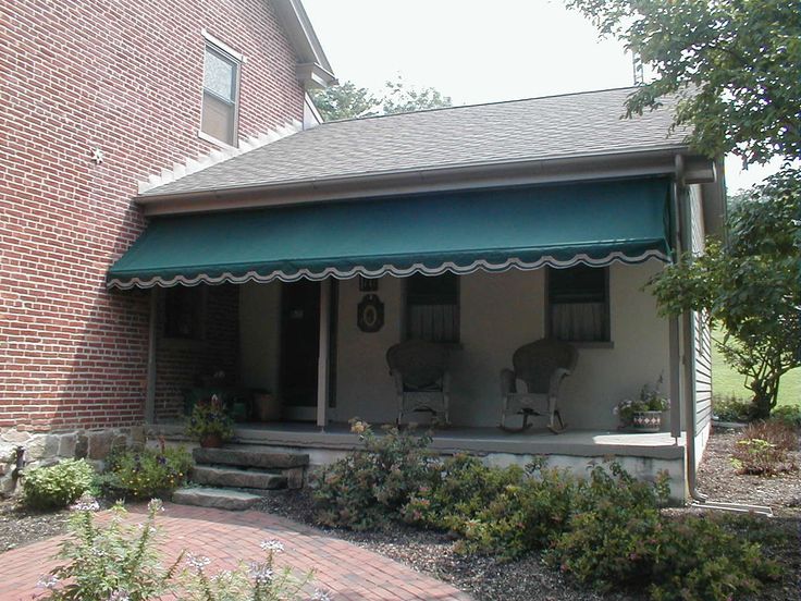 Porch awning installed on a brick farmhouse | Porch awning .