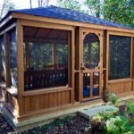 This gazebo features a low knee wall and large screened walls .