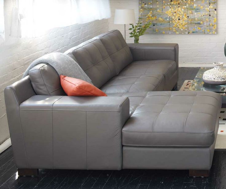 Montez sectional in gray leather, topstiched seat and back .