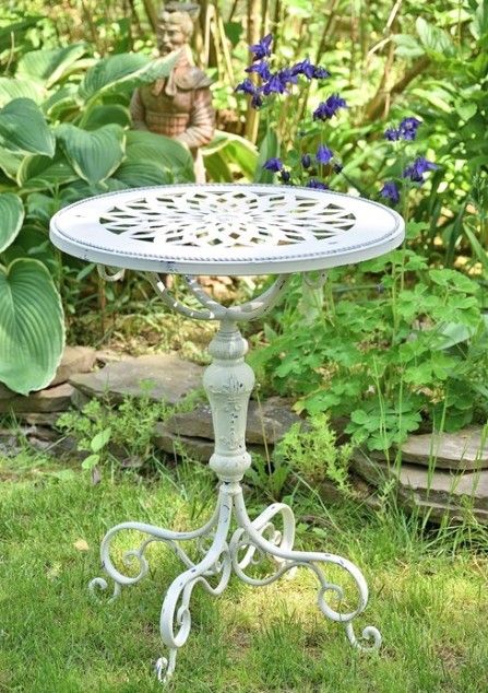small decorative metal round garden table - white or green .