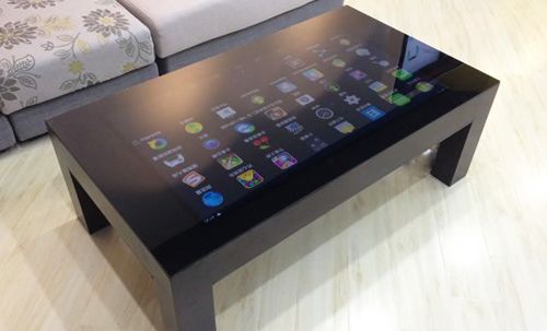 Very nice four leg coffee table with smooth glass top featuring a .