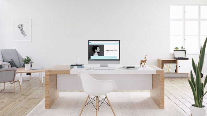 white-wall-rug-wooden-desk-chair-home-office-setup-desktop .