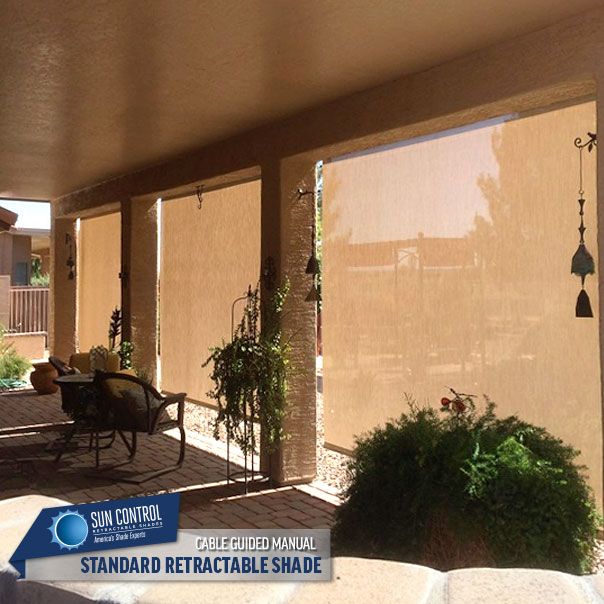 Manual Standard Retractable patio shade with the bungee tie down .